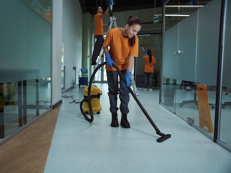 Cleaning Company Workers Washing And Cleansing The Building.  Carpet Cleaning for Offices