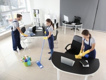 Team Of Janitors Cleaning Office